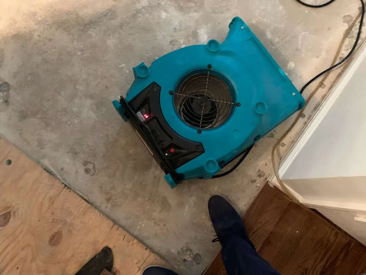 Air mover drying subfloor during Leak Detection & Repair in Maxatawny